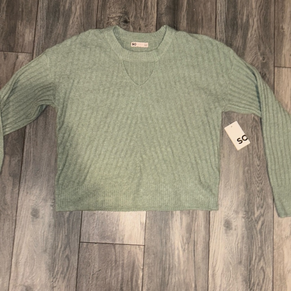 Green SO sweater with a triangle cut out
